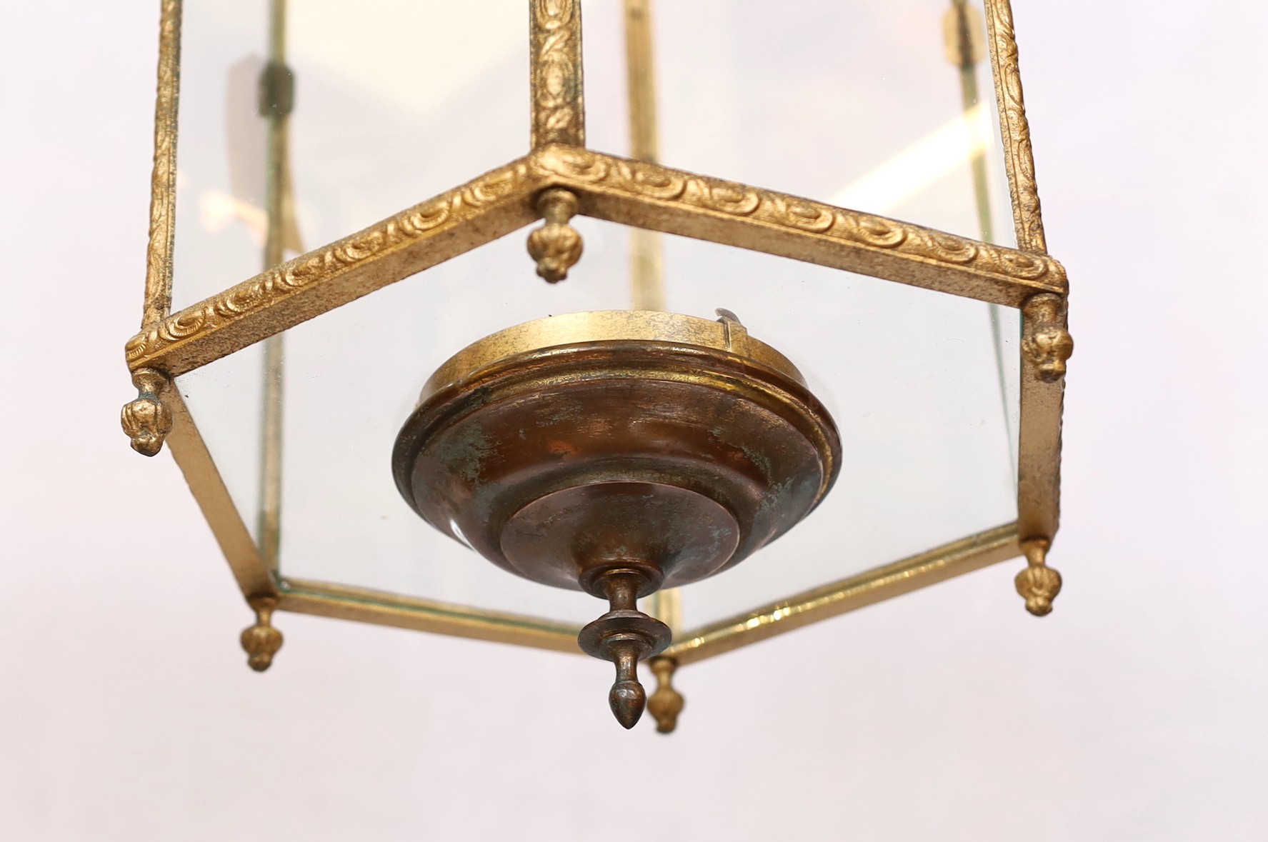 A mid 19th century English hexagonal brass hall lantern with scroll moulded frame, drop from rose 64cm. width 25cm